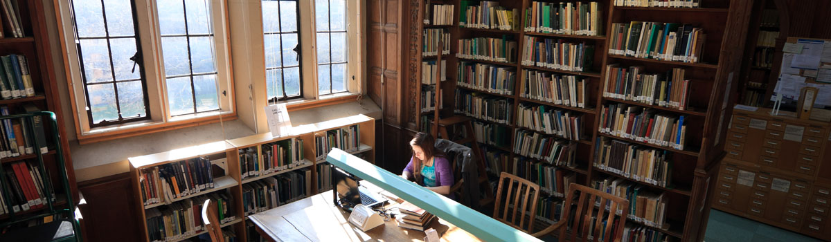 Library with student studying from above