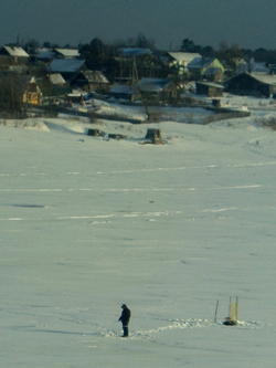 A fisherman stands alone on Lake Sindinskoye near the small town of Mayak in Russia’s Nanai District (Ed Pulford, 2014)