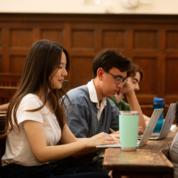 University of Cambridge students listening a lecture in the Student Services Centre old lecture hall.