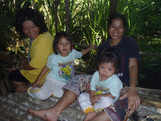Connie and her family inside their lamin tana (Rachel Wyatt, 2013)
