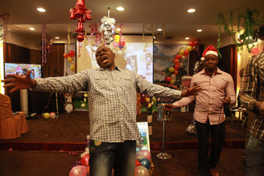 'Praise my God!' - a Nigerian man in an underground African Pentecostal Church, Guangzhou, China (Yu Qiu, 2014)